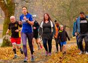 Runners on a leafy path at Leeds Potternewton parkrun 5k