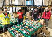 GoodGym Leeds runners packing food ready for donation