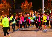 Runners dressed in neon in Leeds city centre.